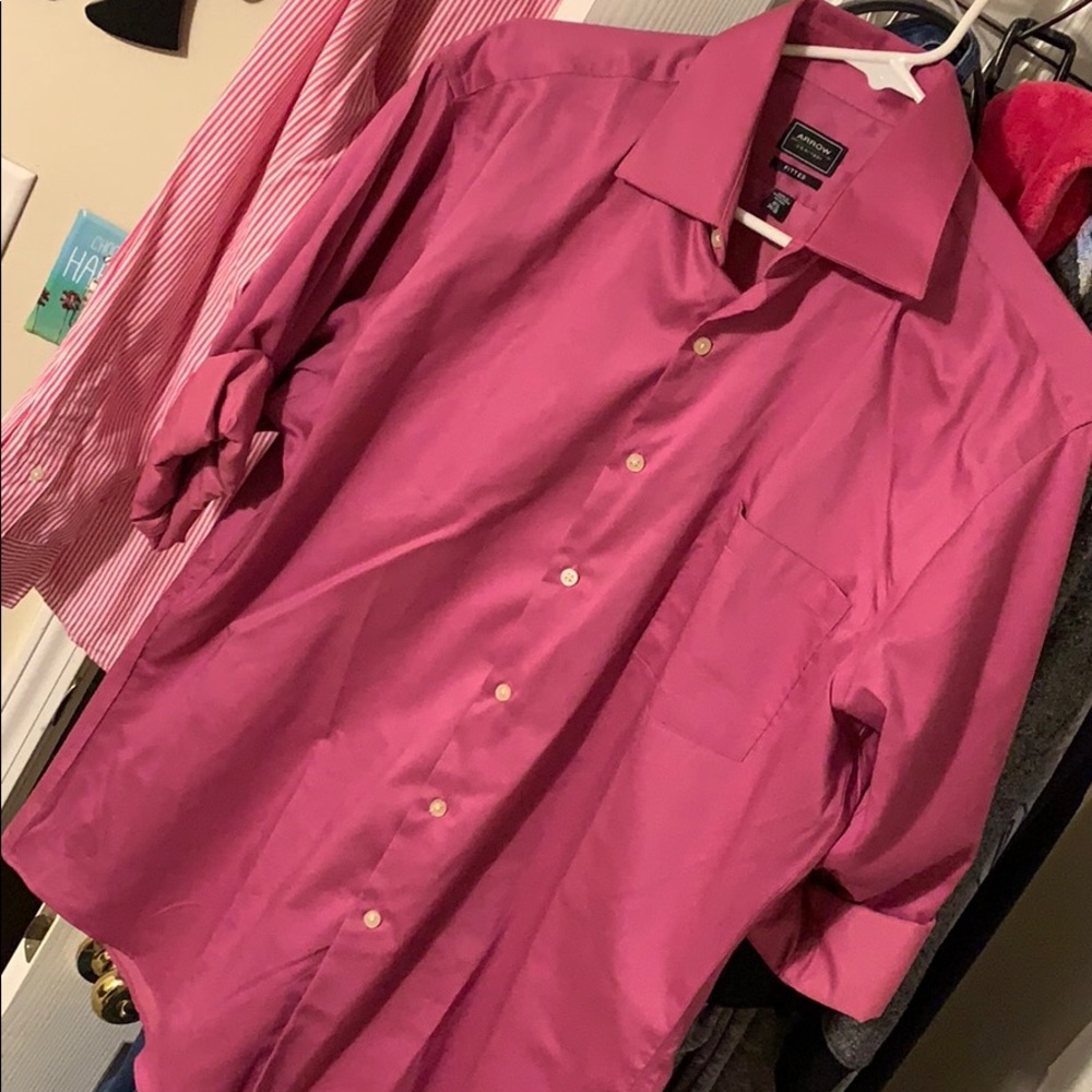 Magenta button up shirt.